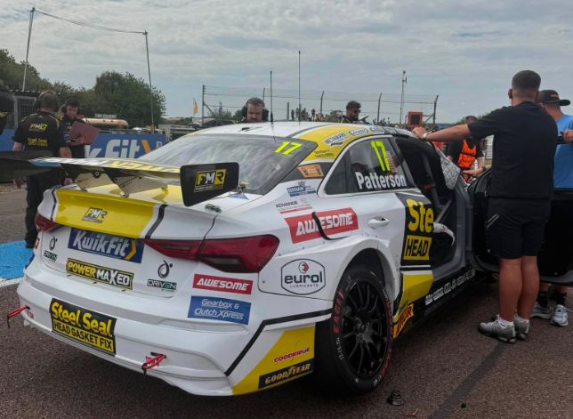 Rear three-quarter view of the Awesome-sponsored #17 Steel Seal Power Maxed Racing Audi S3 on the grid at Thruxton, with Patterson lettering on the rear window